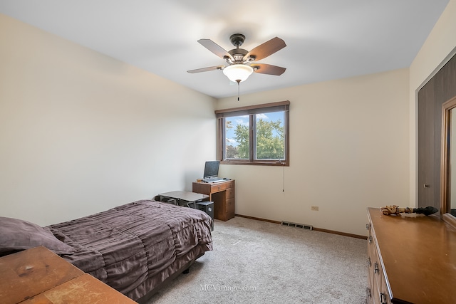 carpeted bedroom with ceiling fan