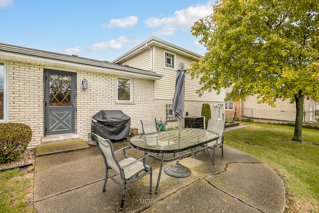 view of patio featuring a grill