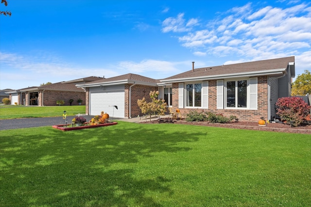 single story home with a front yard and a garage