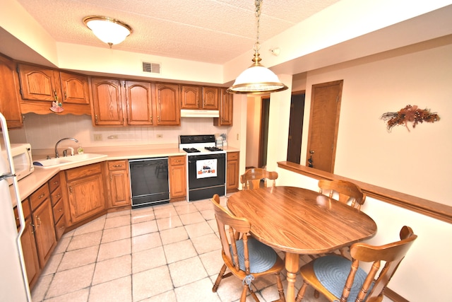 kitchen with sink, dishwasher, a textured ceiling, white stove, and decorative light fixtures