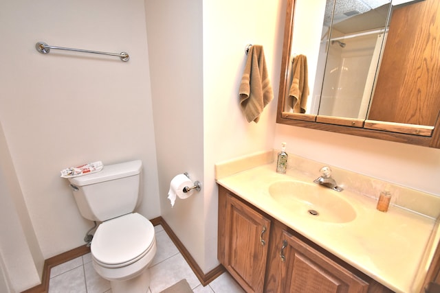 bathroom featuring walk in shower, vanity, toilet, and tile patterned floors