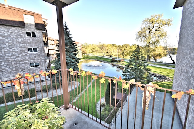 balcony featuring a water view