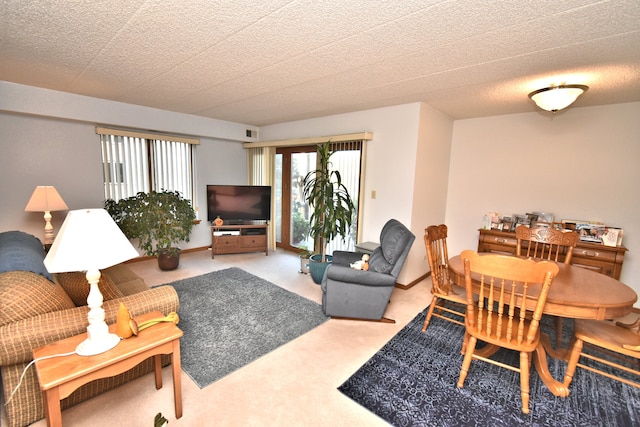 living room featuring a textured ceiling and carpet floors