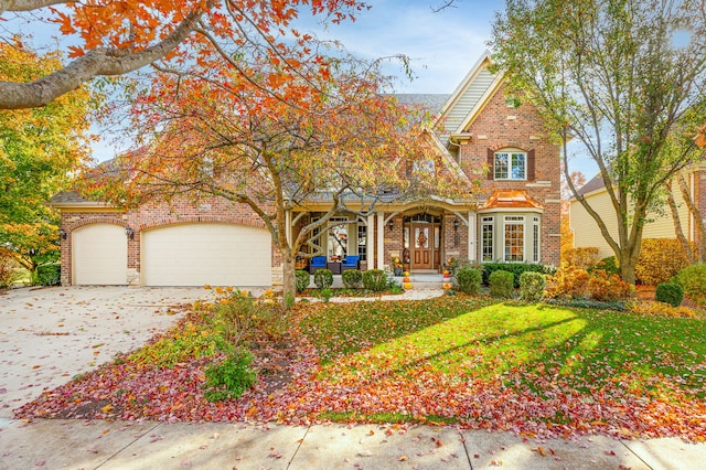 view of front of house featuring a garage and a front yard