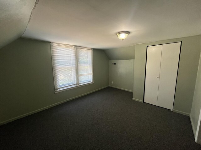 6916 S Lowe Ave, Chicago, IL 60621 - bonus room with dark colored carpet, baseboards, and vaulted ceiling