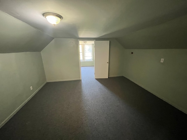 bonus room featuring lofted ceiling