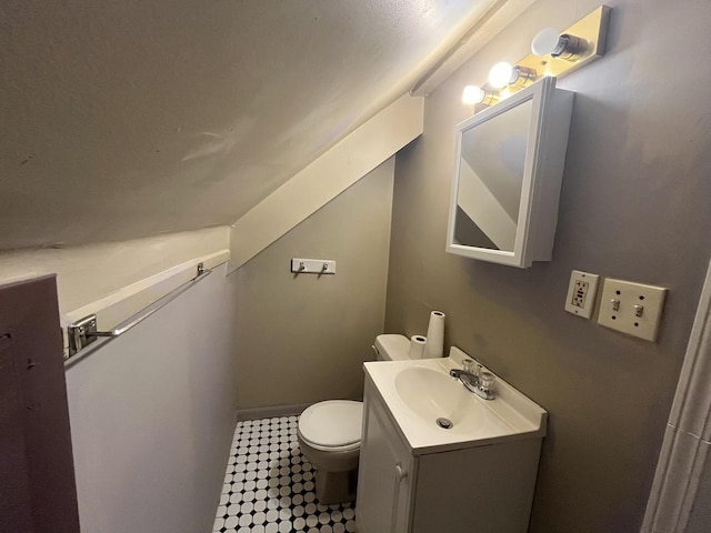 6916 S Lowe Ave, Chicago, IL 60621 - bathroom with toilet, baseboards, and vanity