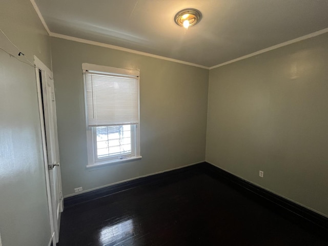 6916 S Lowe Ave, Chicago, IL 60621 - unfurnished room with crown molding, baseboards, and dark wood-type flooring
