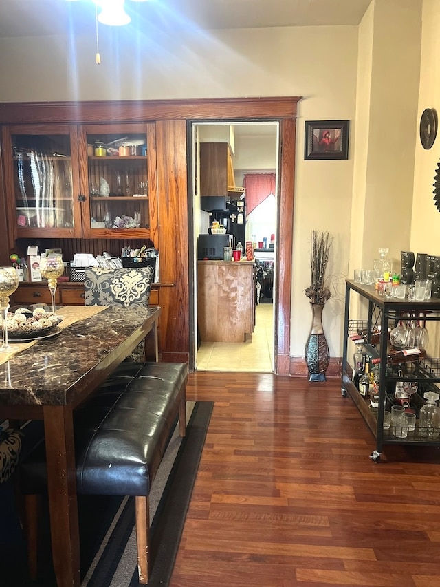 dining space with dark wood-type flooring