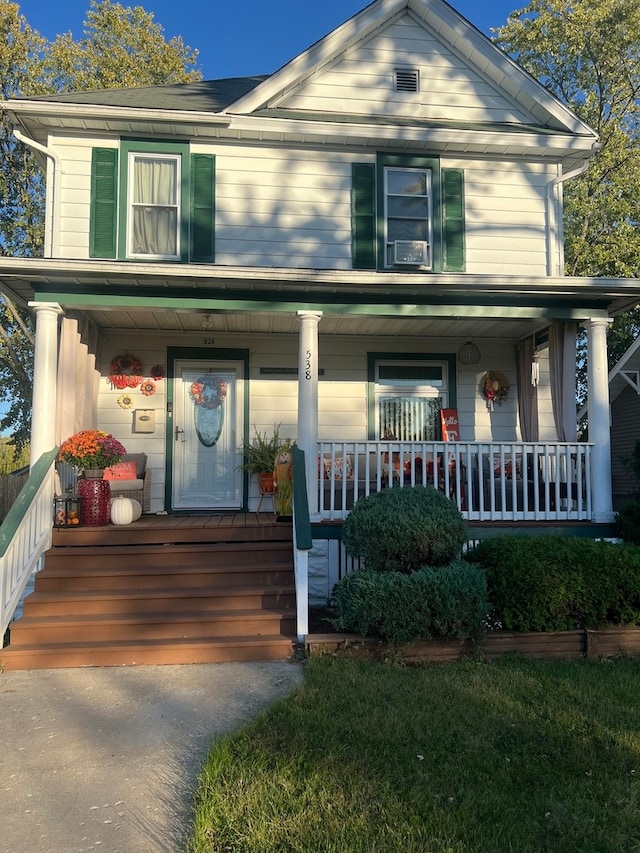 view of front of property featuring covered porch