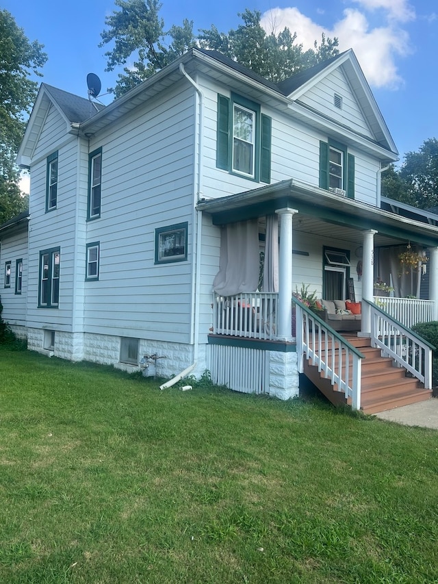 exterior space with a front lawn and covered porch