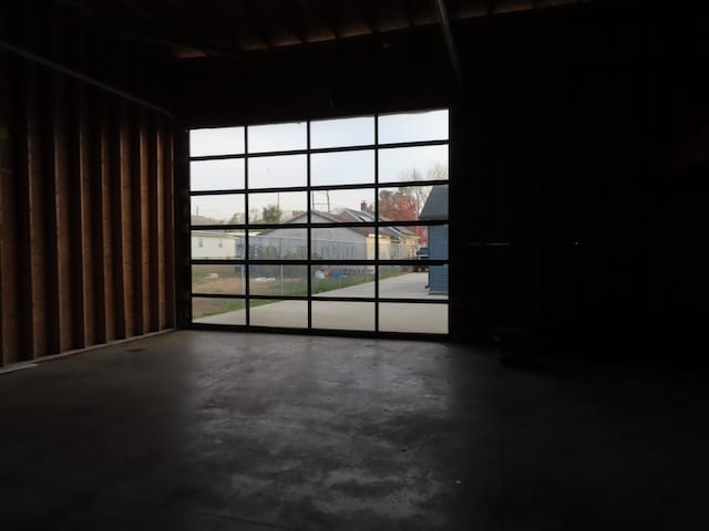 unfurnished room featuring a healthy amount of sunlight and concrete floors