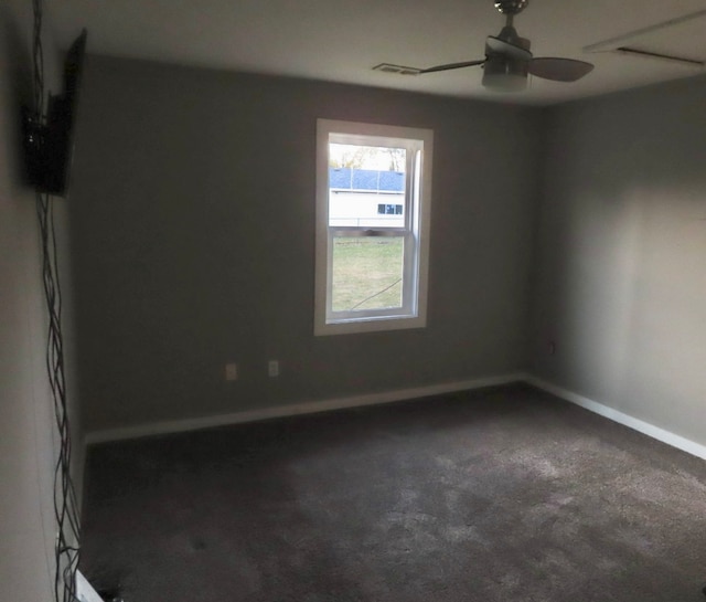 spare room featuring carpet and ceiling fan