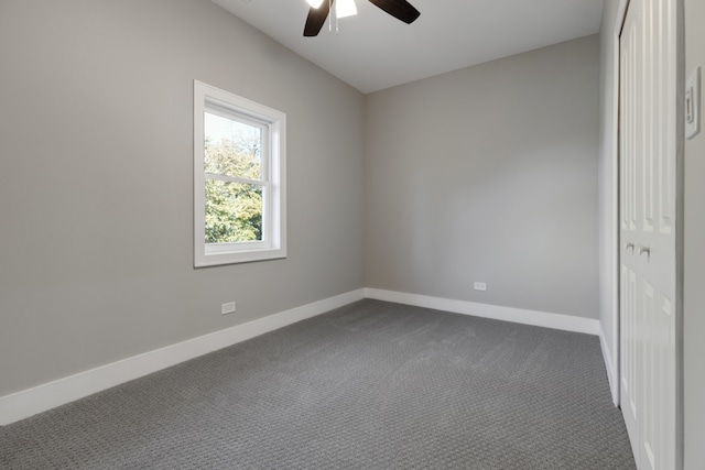 carpeted empty room with ceiling fan