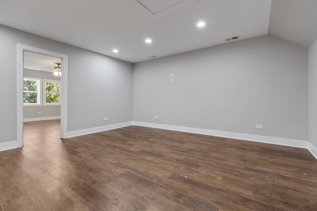 empty room featuring ceiling fan, dark wood-type flooring, and lofted ceiling