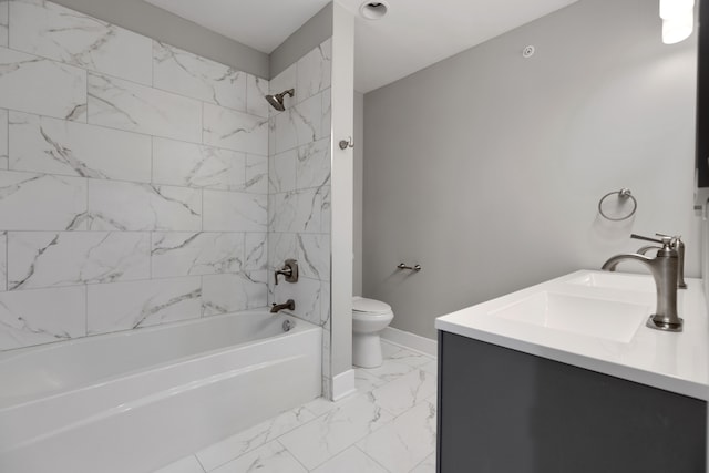 full bathroom with vanity, toilet, and tiled shower / bath