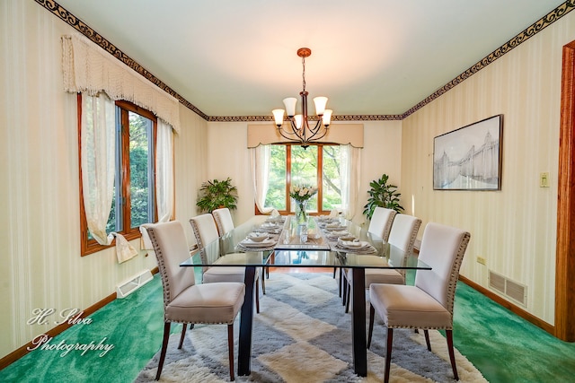 dining room with carpet flooring, a chandelier, and plenty of natural light