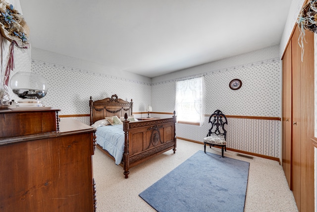 bedroom featuring light colored carpet