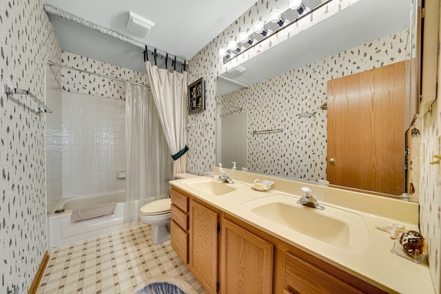 full bathroom featuring vanity, toilet, and shower / bath combo with shower curtain