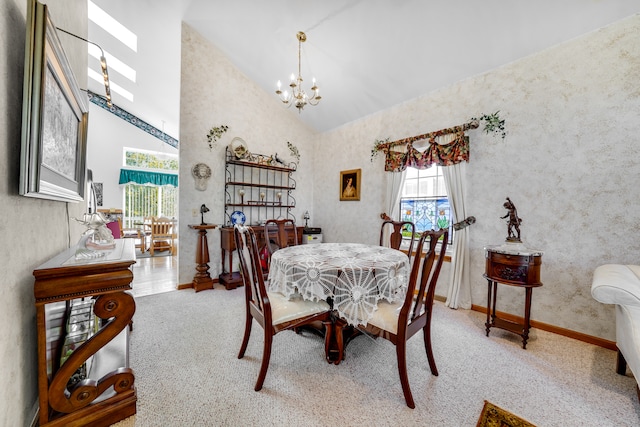 dining space with a notable chandelier, high vaulted ceiling, and carpet flooring