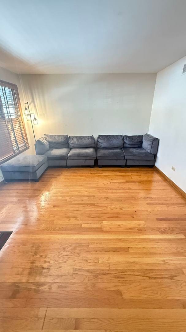 unfurnished living room featuring light hardwood / wood-style flooring