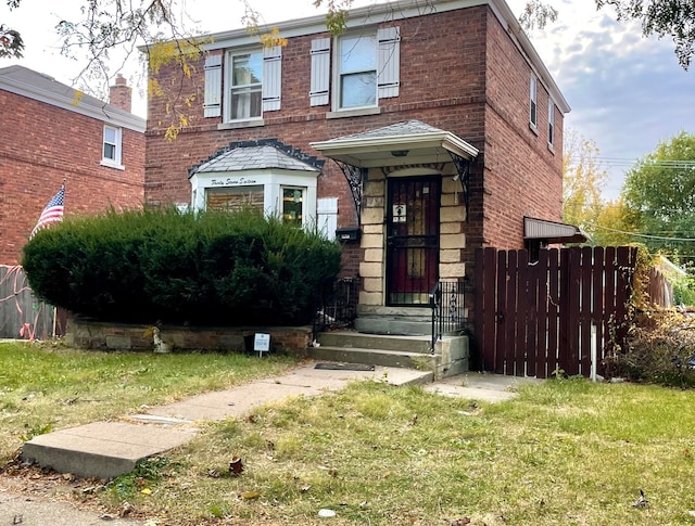 view of front of property with a front lawn