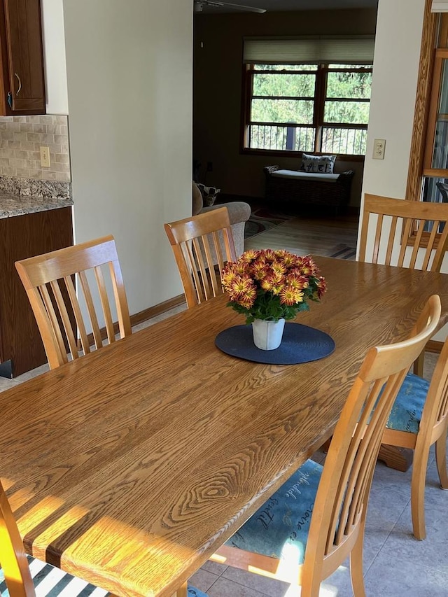 dining area featuring light tile patterned floors