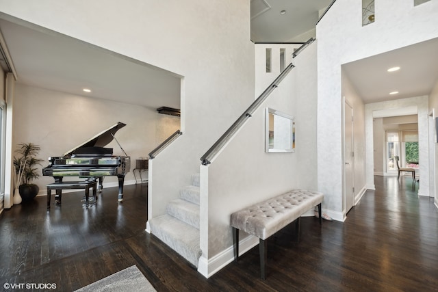 staircase with hardwood / wood-style flooring