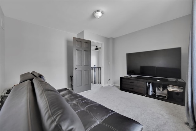 carpeted living room featuring ceiling fan