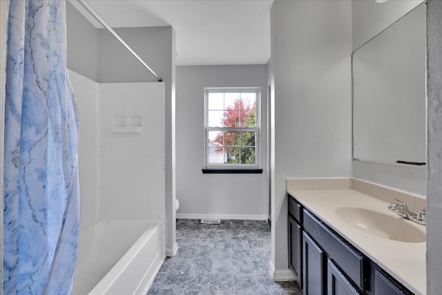 full bathroom featuring vanity, shower / tub combo with curtain, and toilet