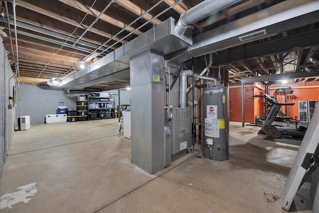 basement featuring heating unit and gas water heater