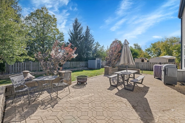 view of patio / terrace with an outdoor fire pit