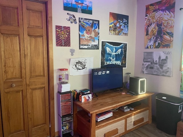 home office with dark hardwood / wood-style flooring