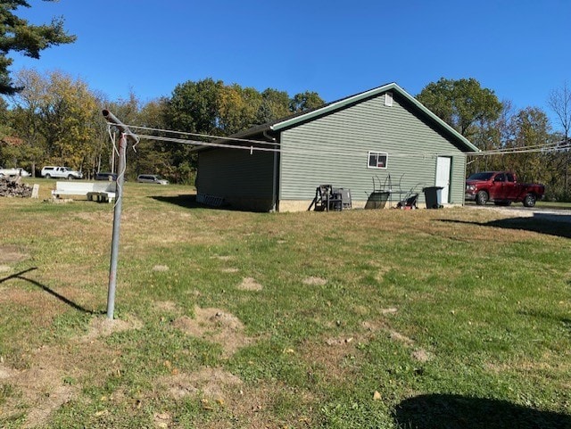 view of home's exterior featuring a yard