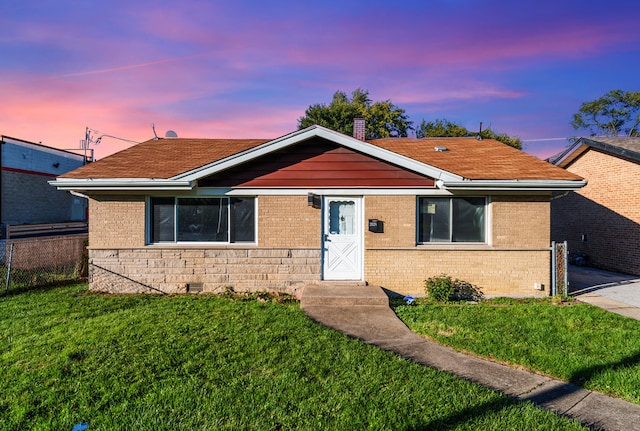 view of front of house with a lawn