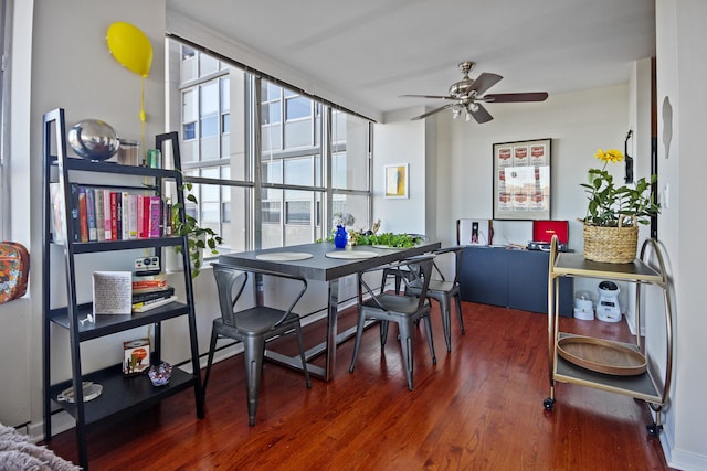 dining area featuring ceiling fan and dark hardwood / wood-style flooring