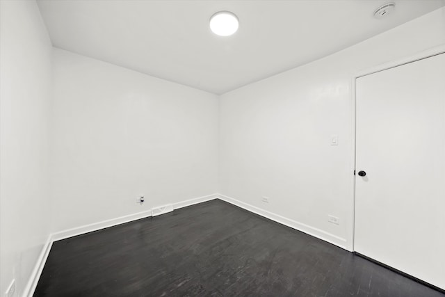 empty room featuring dark hardwood / wood-style floors