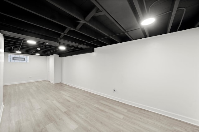 basement with light wood-type flooring