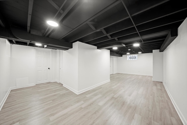 basement with light wood-type flooring