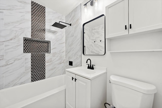 full bathroom featuring vanity, toilet, and tiled shower / bath combo