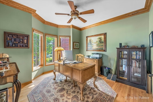 office with ornamental molding, french doors, light hardwood / wood-style flooring, and ceiling fan