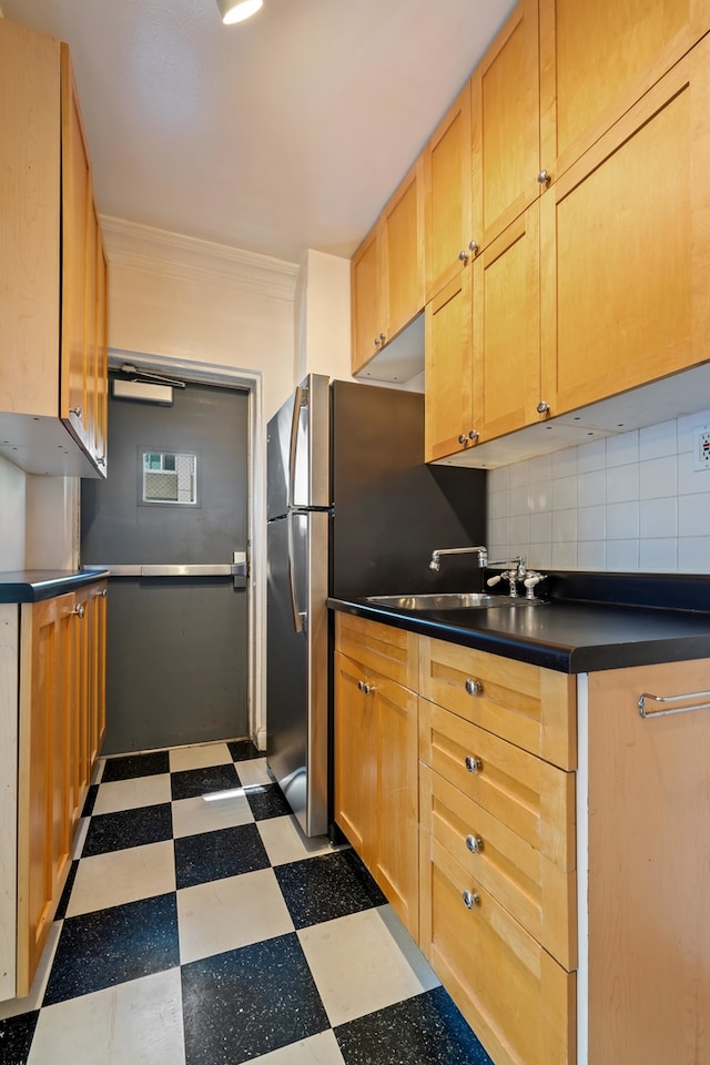 kitchen with decorative backsplash, sink, and ornamental molding