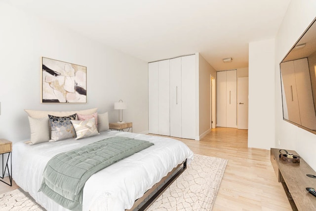 bedroom with light wood-type flooring