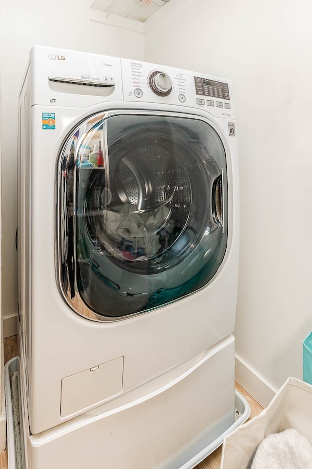 washroom featuring washer / dryer