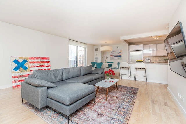 living room with light hardwood / wood-style floors