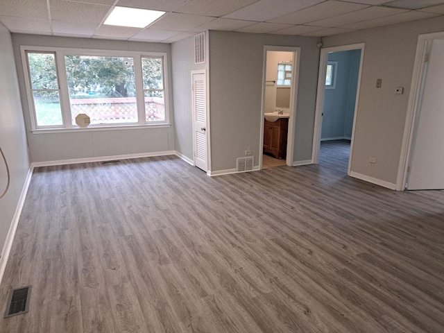 426 Suwanee St, Park Forest, IL 60466 - unfurnished room featuring a paneled ceiling, wood finished floors, and baseboards
