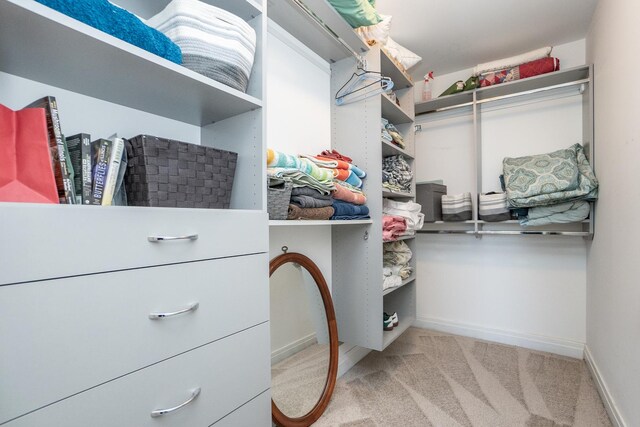 carpeted bedroom with multiple windows