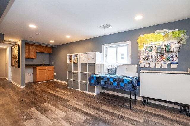 laundry area featuring stacked washing maching and dryer and light tile patterned floors