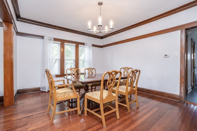 dining space featuring ornamental molding, a notable chandelier, and dark hardwood / wood-style flooring