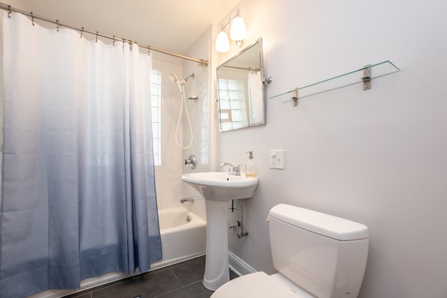 full bathroom with toilet, shower / tub combo, sink, and tile patterned flooring